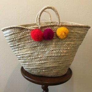 Beach bag with pom pom detail